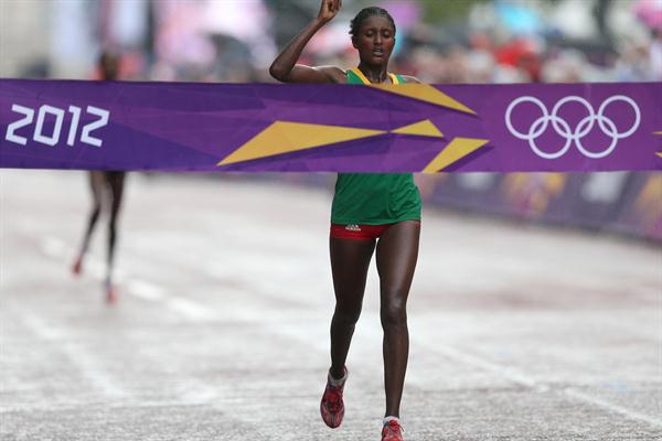 Tiki Gelana of Ethiopia celebrates as she crosses the finish line to win the gold medal in the Women's Marathon at The Mall on Day 9 of the London 2012 Olympic Games on August 5, 2012 (Getty Images)
