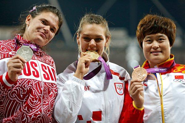 (R-L) Bronze medalist Yanfeng Li of China , gold medalist Sandra Perkovic of Croatia and silver medalist Darya Pishchalnikova of Russia pose on the podium during the medal ceremony for Women's Discus Throw on Day 8 of the London 2012 Olympic Games at Olympic Stadium on August 4, 2012 in London, England (Getty Images)