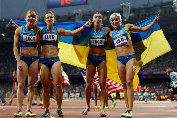 Bronze medalists Olesya Povh of Ukraine, Hrystyna Stuy of Ukraine, Mariya Ryemyen of Ukraine and Elyzaveta Bryzgina of Ukraine celebrate after the Women's 4 x 100m Relay Final of the London Olympic Games on 10 August 2012 (Getty Images)