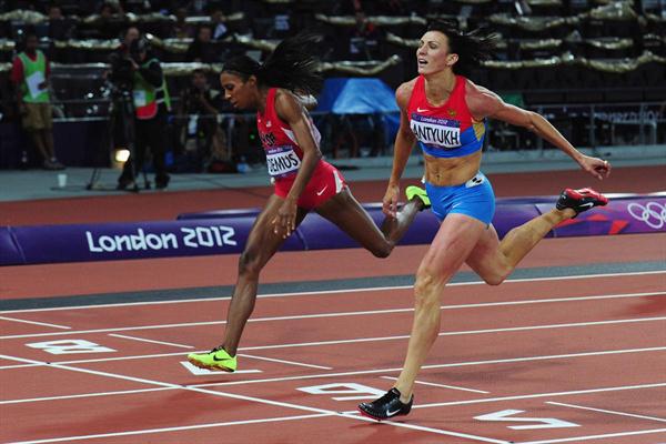 Natalya Antyukh of Russia crosses the finish line ahead of Lashinda Demus of the United States in the Women's 400m Hurdles Final on Day 12 of the London 2012 Olympic Games on 8 August 2012 (Getty Images)