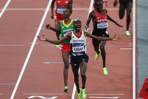 Mo Farah of Great Britain crosses the finish line to win gold ahead of Dejen Gebremeskel of Ethiopia and Thomas Pkemei Longosiwa of Kenya in the Men's 5000m Final on Day 15 of the London 2012 Olympic Games on August 11, 2012 (Getty Images)