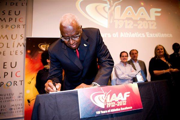 IAAF President Lamine Diack sgning the Honoured Guest Book of the IAAF Centenary Historic Exhibition (Getty Images)