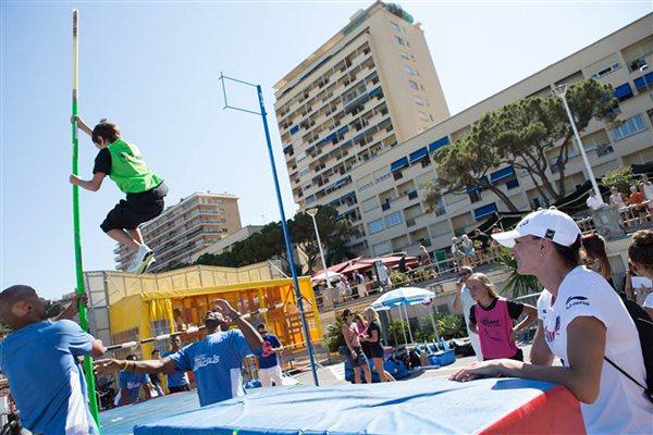 Yelena Isinbayeva encourages a kid during the IAAF-Nestlé Kids’ Athletics in Monaco leading up to the Herculis meeting  (Philippe Fitte)