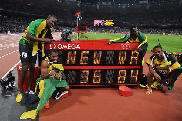 Winning Jamaican team: Usain Bolt, Yohan Blake, Michael Frater and Nesta Carter next to the clock showing the new world record of 36.84 in the Men's 4 x 100m Relay Final of the London 2012 Olympic Games on August 11, 2012 (Getty Images)
