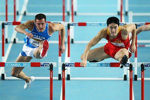 (L-R) Emanuel Abate of Italy and Lui Xiang of China competes in the Men’s 60 Metres Hurdles semi final during day three - WIC Istanbul (Getty Images)