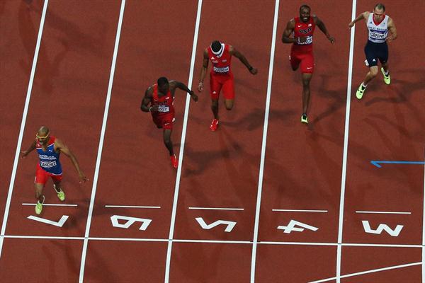 Felix Sanchez of Dominican Republic crosses the finish line ahead of Michael Tinsley of the United States to win the gold medal in the Men's 400m Hurdles final on Day of the 2012 London Olympic Games on 6 August 2012 (Getty Images)
