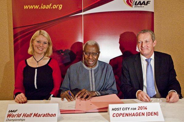 IAAF President Lamine Diack (c), with Copenhagen Mayor of Sport and Culture Pia Allerslev, and Lars Lundon after the city's winning bid was announced to host the 2014 IAAF World Half Marathon Championships (Philippe Fitte)