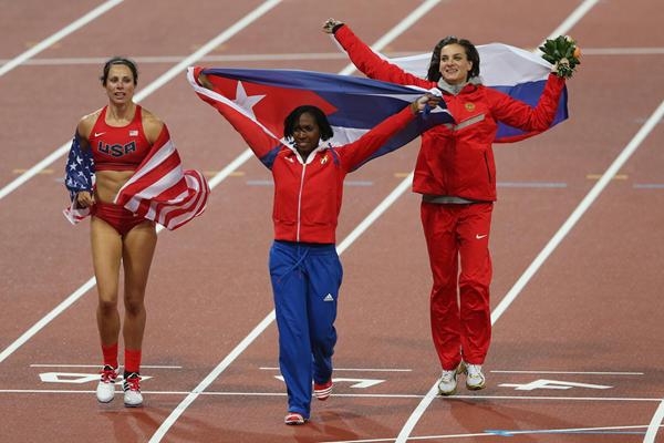 Gold medallist Jennifer Suhr, silver medallist Yarisley Silva and Elena Isinbaeva celebrate after the Pole Vault final at the London 2012 Olympics (Getty Images)