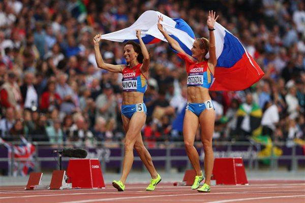 Gold medalist Mariya Savinova (L) of Russia celebrates with bronze medalist Ekaterina Poistogova of Russia after the Women's 800m Final of the London Olympic Games on 11 August 2012 (Getty Images)