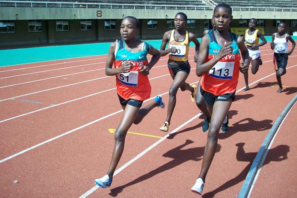 Kenyans Mercy Chepwogen (51) and Edna Chepkemoi and Ugandan Stella Chesang (middle) lead the women's 3000m field during the EAAR Youth Championships at Mandela Stadium, Kampala (Daniel Senfuma)