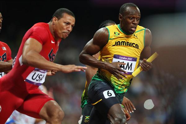 Usain Bolt of Jamaica receives the relay baton from Yohan Blake of Jamaica next to Ryan Bailey of the United States during the Men's 4 x 100m Relay Final  of the London 2012 Olympic Games on August 11, 2012  (Getty Images)