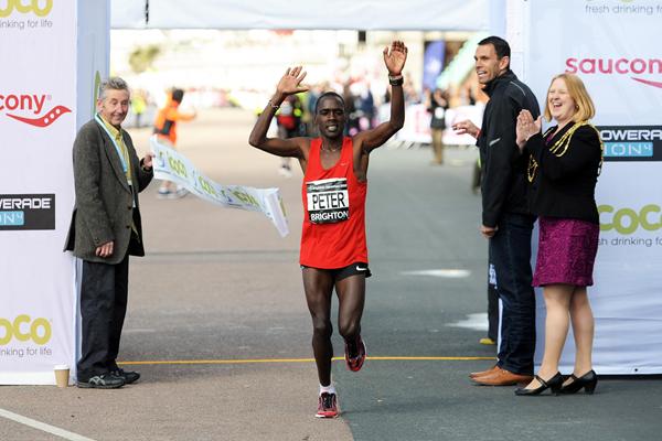 Peter Some wins the 2012 Brighton Marathon; (left) Ron Hill (Mark Shearman)