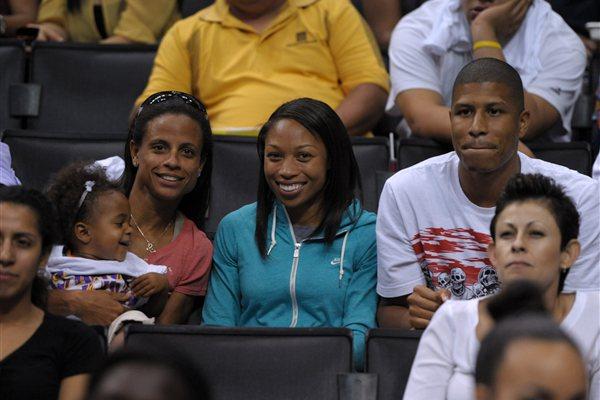 Allyson Felix with Joanna Hayes and Kenneth Ferguson at Los Angeles Sparks WNBA game (Kirby Lee)