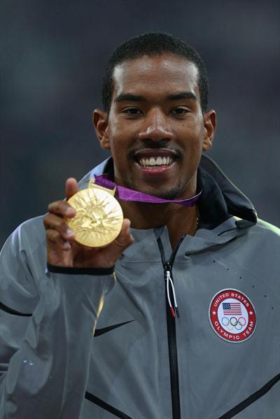 Gold medalist Christian Taylor of the United States celebrates on the podium during the medal ceremony for the Men's Triple Jump on Day 13 of the London 2012 Olympic Games on 10 August 2012 (Getty Images)