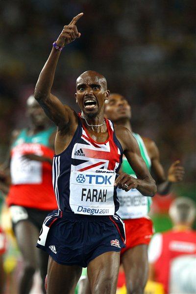  Mohamed Farah of Great Britain celebrates as he crosses the finish line to claim victory in the men's 5000 metres final  (Getty Images)