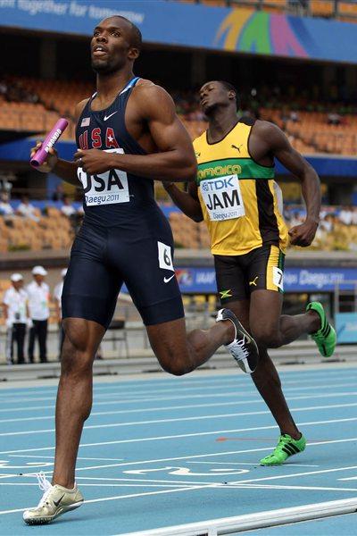 LaShawn Merritt of United States runs the final leg ahead of Leford Green of Jamaica in the men's 4x400 metres relay heats during day six (Getty Images)