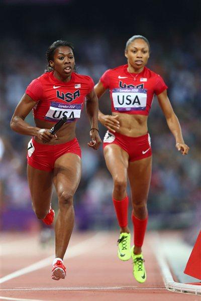 Francena McCorory of the United States receives the relay baton from Allyson Felix of the United States on their way to winning gold in the Women's 4 x 400m Relay Final of the London 2012 Olympic Games on August 11, 2012  (Getty Images)