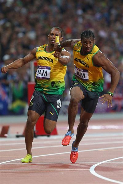 Yohan Blake of Jamaica receives the relay baton from Michael Frater of Jamaica during the Men's 4 x 100m Relay of the London 2012 Olympic Games on 11 August 2012 (Getty Images)