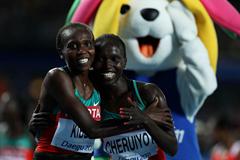 Vivian Jepkemoi Cheruiyot of Kenya celebrates winning the women's 5000 metres final with Sylvia Jebiwott Kibet of Kenya  (Getty Images)