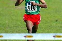 Bekele signals the win as he crosses the finish (Getty Images)