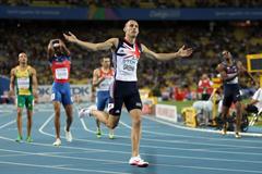 David Greene of Great Britain celebrates after crossing the finish line and claiming gold in the men's 400 metres hurdles final (Getty Images)