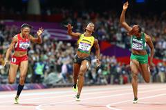 Shelly-Ann Fraser-Pryce of Jamaica crosses the line to win the gold ahead of Allyson Felix of the United States (L) and Blessing Okagbare of Nigeria (R) in the Women's 100m Final on Day 8 of the London 2012 Olympic Games at Olympic Stadium on August 4, 2012  (Getty Images)