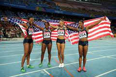 (L-R) Allyson Felix, Bianca Knight, Marshevet Myers and Carmelita Jeter of the USA celebrate victory in the women's 4x100 metres relay final  (Getty Images)