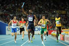 LaShawn Merritt of the USA crosses the finish line ahead of L.J. van Zyl of South Africa to claim victory in the men's 4x400 metres relay final (Getty Images)