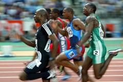 Kim Collins leads the final of the men's 100 metres (Getty Images)