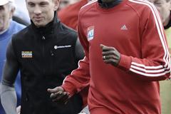 Wilson Kipketer accompanied by Speedway star Andreas Jonsson in Bydgoszcz, Poland (Roman Bosiacki)