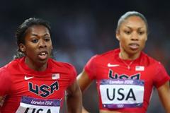 Francena McCorory of the United States receives the relay baton from Allyson Felix of the United States on their way to winning gold in the Women's 4 x 400m Relay Final of the London 2012 Olympic Games on August 11, 2012  (Getty Images)