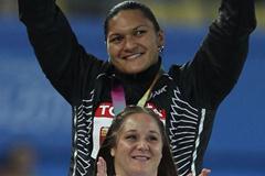 Gold medalist Valerie Adams of New Zealand and bronze medalist Jillian Camarena-Williams of United States celebrate on the podium with their medals for the women's shot put final (Getty Images)