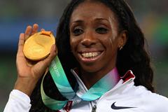 Lashinda Demus of the USA poses with the gold medal during the medal ceremony for the women's 400 metres hurdles (Getty Images)