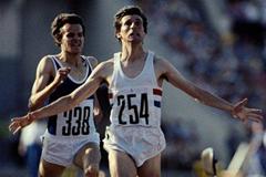 Sebastian Coe of Great Britain raises his arms in celebration as he crosses the finish line ahead of Jurgen Straub to win the men's 1500m race on 1st August 1980 at the XXII Summer Olympic Games in Moscow, Russia ()