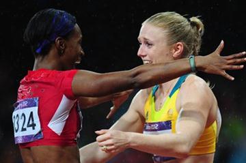 Sally Pearson of Australia hugs Kellie Wells of the United States after winning the gold medal in the Women's 100m Hurdles Final on Day 11 of the London 2012 Olympic Games on 7 August 2012 (Getty Images)