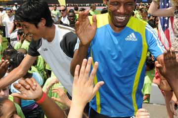 Marathon world record holder Haile Gebrselassie (right) of Ethiopia and Arata Fujiwara of Japan (left) take part in the National Running Day festivities in New York (organisers)