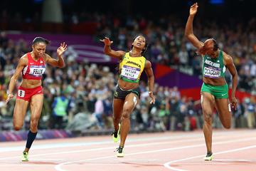 Shelly-Ann Fraser-Pryce of Jamaica crosses the line to win the gold ahead of Allyson Felix of the United States (L) and Blessing Okagbare of Nigeria (R) in the Women's 100m Final on Day 8 of the London 2012 Olympic Games at Olympic Stadium on August 4, 2012 (Getty Images)