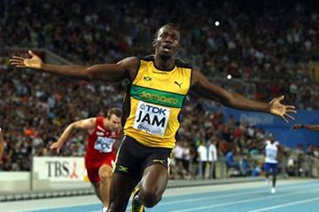 Usain Bolt of Jamaica celebrates victory and a new world record in the men's 4x100 metres relay final (Getty Images)