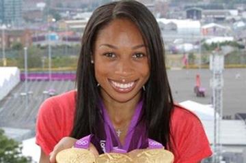 Allyson Felix with collection of London gold (Kirby Lee)