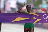 Tiki Gelana of Ethiopia celebrates as she crosses the finish line to win the gold medal in the Women's Marathon at The Mall on Day 9 of the London 2012 Olympic Games on August 5, 2012 (Getty Images)