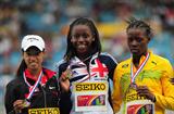 Gold medal winner Desiree HENRY (GBR) (c) celebrates with Christian BRENNAN (CAN) and Shericka JACKSON (JAM) (r) after winning the Girls 200 meters - Day Five - WYC Lille 2011 (Getty Images)