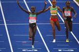 Vivian Cheruiyot of Kenya crosses the line to win the gold medal in the women's 5000m final at the 12th IAAF World Championships in Athletics (Getty Images)
