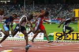 Kim Collins dips to the finish to win the men's 100m final (Getty Images)
