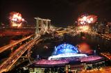 A burst of fireworks explodes in the night sky during the opening ceremony of the Singapore 2010 Youth Olympic Games (YOG) (SPH-SYOGOC / Alphonsus Chern)