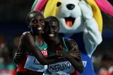 Vivian Jepkemoi Cheruiyot of Kenya celebrates winning the women's 5000 metres final with Sylvia Jebiwott Kibet of Kenya  (Getty Images)