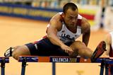 Bryan Clay powers to victory in the heptathlon 60m hurdles (Getty Images)