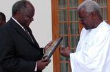 l to r: President Mwai Kibaki of Kenya receives plaque from Lamine Diack in Nairobi (c)