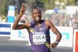 Tadesse Tola improves all the way to 2:06:23 to take the 2010 Paris Marathon (Getty Images)