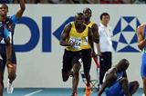 (L-R) Travis Padgett of United States receives the relay baton from team mate Maurice Mitchell next to Aziz Zakari of Ghana and Bruno de Barros of Brazil as they compete in the men's 4x100 metres heats  (Getty Images Steele)