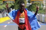 Lornah Kiplagat celebrates her third consecutive victory at the World Half Marathon championships (Getty Images)